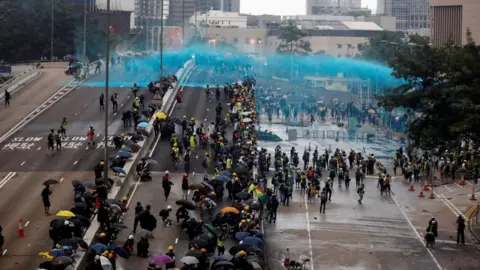 Reuters Riot police fired a water cannon during a protest against the extradition bill in 2019