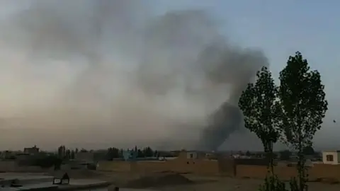 AFP Smoke rises into the air after Taliban militants launched an attack on the Afghan provincial capital Ghazni