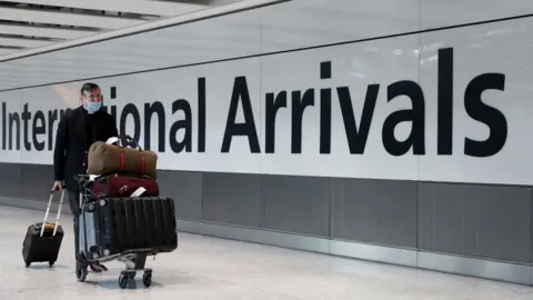 AFP Passenger at Heathrow international arrivals