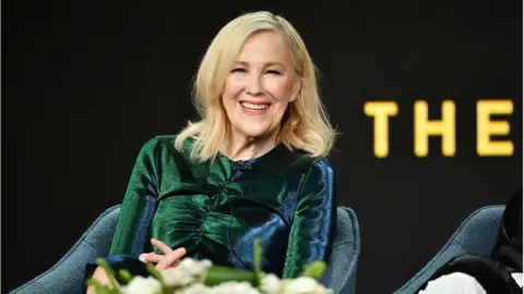 Getty Images Catherine O'Hara of "Schitt's Creek" speaks during the Pop TV segment of the 2020 Winter TCA Press Tour