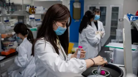 AFP Scientists in lab in Beijing working on coronavirus vaccine