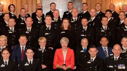 Police Federation awards Theresa May with award winners