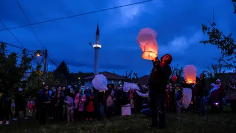 Getty Images People in Sarajevo release sky lanterns to mark the beginning of Ramadan