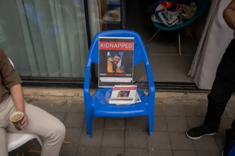 A poster of Avi's son, Alon Shamriz, a 26-year-old computer engineer who has been missing since 7 October.