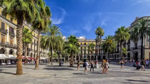 Getty Images Tourists in Barcelona's Gothic quarter