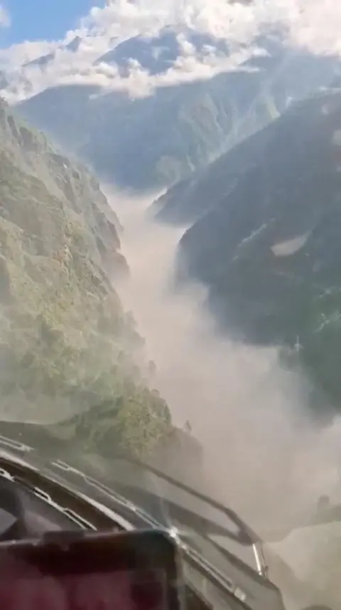 Reuters Helicopter footage shows flash flooding in the valleys in Rasuwa, Nepal, August 26, 2026, in this screengab taken from a handout video.