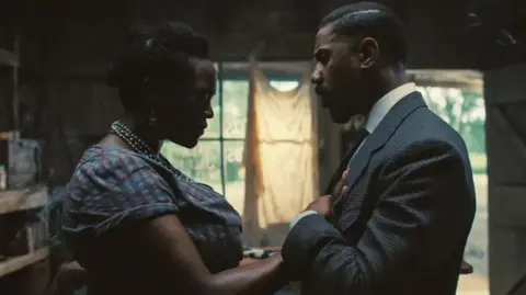 Warner Bros Wunmi Mosaku and Michael B Jordan in Sinners 