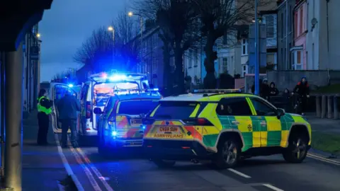Gruffydd Thomas Police cars and ambulances on Picton Terrace in Carmarthen