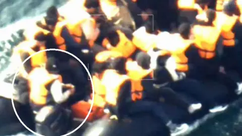 PA A group of people are crowded on an inflatable boat