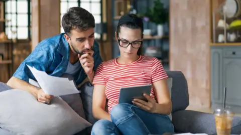 Couple looking at tablet computer