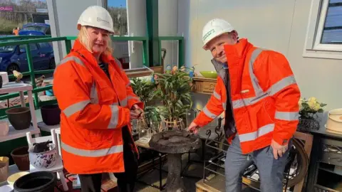 Derbyshire County Council Councillor Carolyn Renwick and contract manager Craig Capper at the council's household waste and recycling centre in Bolsover