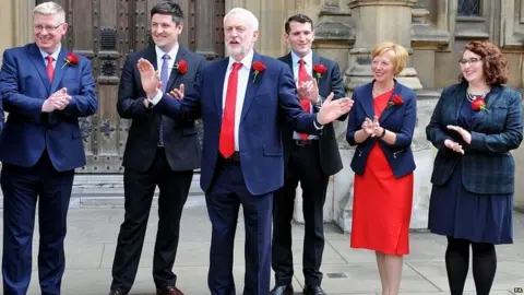 PA The Labour leader with some of his newly elected MPs in Westminster