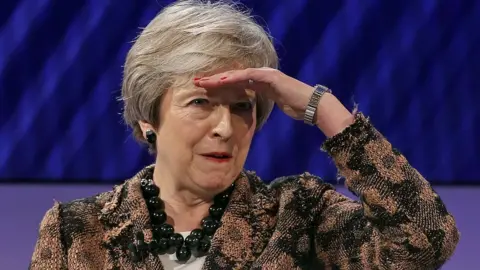 Adrian Dennis/Getty Images UK Prime Minister Theresa May gestures as she takes a question at the annual Confederation of British Industry (CBI) conference in central London, 19 November 2018