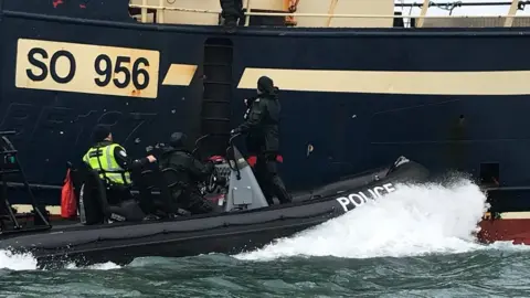 Department of Justice A fishing boat being raided
