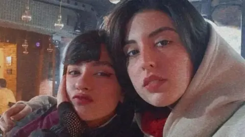 Social media Undated photo showing Nika Shakarami (L), who was killed during protests in Iran in September 2022, and her sister Aida Shakarami (R)