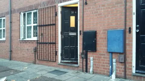 A residential property in Nottingham (seen on the left of this picture) was raided by police in connection with the inquiry