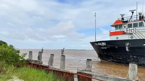 Reuters A view of a ship off the coast, at the construction site of a $30 million marine facility by Guyanese builder Gaico Construction and General Services Inc. in Georgetown, Guyana February 14, 2022