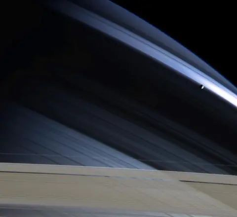 NASA/JPL/Space Science Institute Mimas against Saturn's northern hemisphere