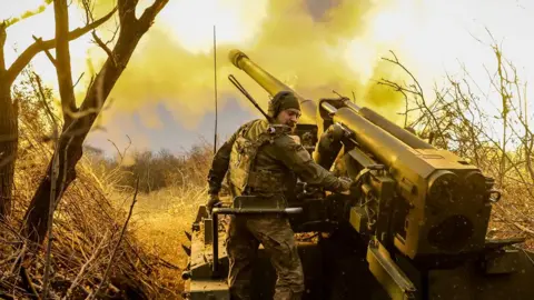 Servicemen of the 24th Mechanized Brigade fire a 2S5 self-propelled 152mm howitzer towards Russian positions near Chasiv Yar in Donetsk region, Ukraine, on 18 November 2024