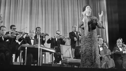 AFP/GETTY IMAGES The late Umm Kulthum, seen here in 1967, enjoys legendary status across the Middle East