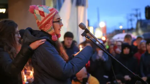 Reuters Sophia Levin speaks at a microphone