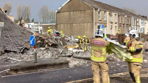 PA Media Picture shows destruction at the scene