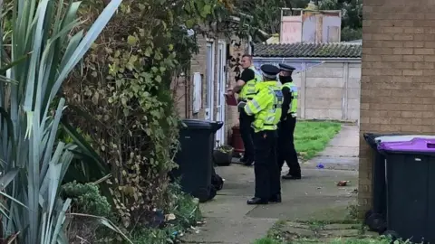 Officers outside the property