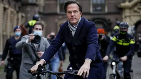 EPA After a Friday cabinet meeting the Dutch leader cycled to the palace to submit the government's resignation to King Willem-Alexander