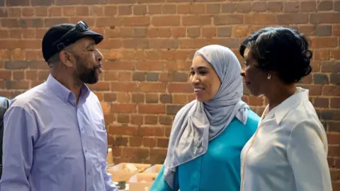 Empowering Sisters Rhyanne White with her parents