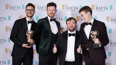 Getty/Dominic Lipinski Tom Berkeley, Seamus O'Hara, James Martin and Ross White with the British Short Film Award for An Irish Goodbye
