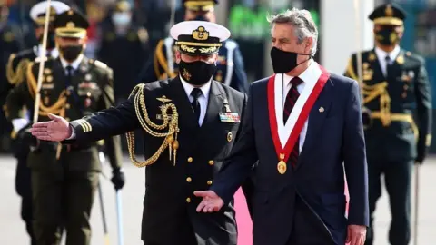 Getty Images Francisco Sagasti appears at his inauguration, wearing a face mask