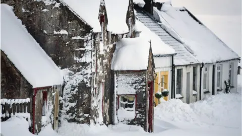 Getty Images Snowy houses