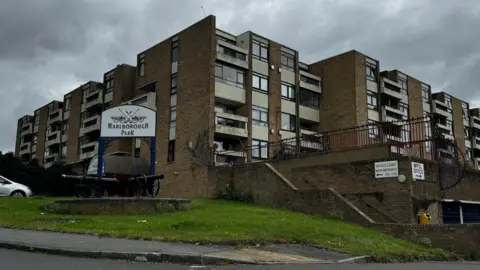A block of flats with a sign reading Marlborough Park.