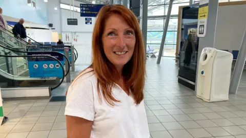 Ian Barmer/BBC Julie Martine, passenger travelling from London Southend Airport