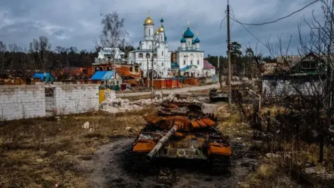 AFP A destroyed Russian tank near a church in the city of Sviatohirsk, Donetsk