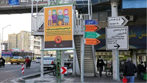 Getty Images A prevention campaign poster in the capital Tehran