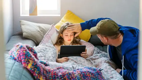 Getty Images Sick child resting at home