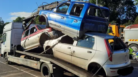 Cars on the back of a trailer