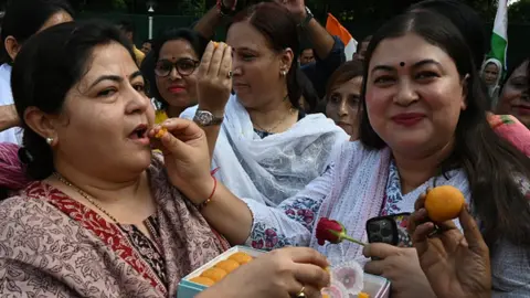 Getty Images All India Mahila Congress President Netta D'Souza with congress Leader Ragini Nayak and Congress leader and party workers