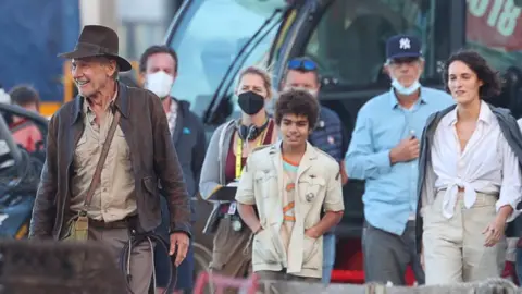 Getty Images Harrison Ford, Phoebe Waller-Bridge and others on the set of the latest Indiana Jones movie