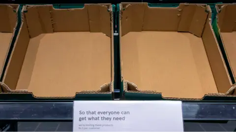 Getty Images Empty fresh produce boxes in a UK supermarket