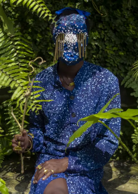 Africa Fashion at the V&A Person wearing a blue outfit