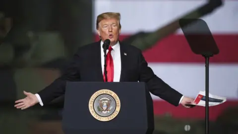 Getty Images President Donald Trump in a visit to an Ohio tank factory March 2019