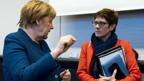 EPA German Chancellor Angela Merkel (left) and CPU leader Annegret Kramp-Karrenbauer. Photo: February 2019