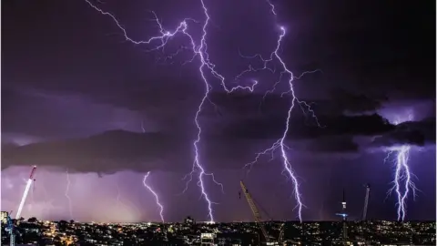 Lightning storm blazes across Queensland skies