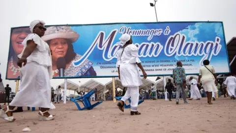 AFP Followers of controversial preacher Elisabeth Wosho Onyumbe arriving at her funeral in Kinshasa, DR Congo - Saturday 23 June 2018