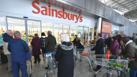 Getty Images Sainsbury's shoppers queueing