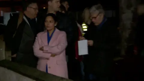 Priti Patel outside the house