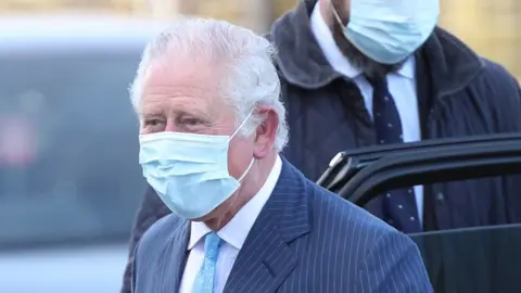 PA Media The Prince of Wales arrives for a visit to an NHS vaccine pop-up clinic at Jesus House church, north London