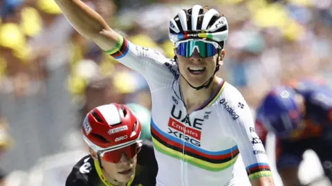 Tadej Pogacar celebrates winning stage seven of the 2025 Tour de France 